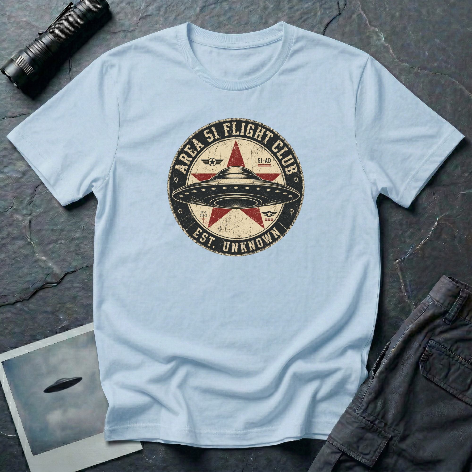 Area 51 Flight Club UFO t-shirt with saucer and red star on vintage stamp badge, light blue