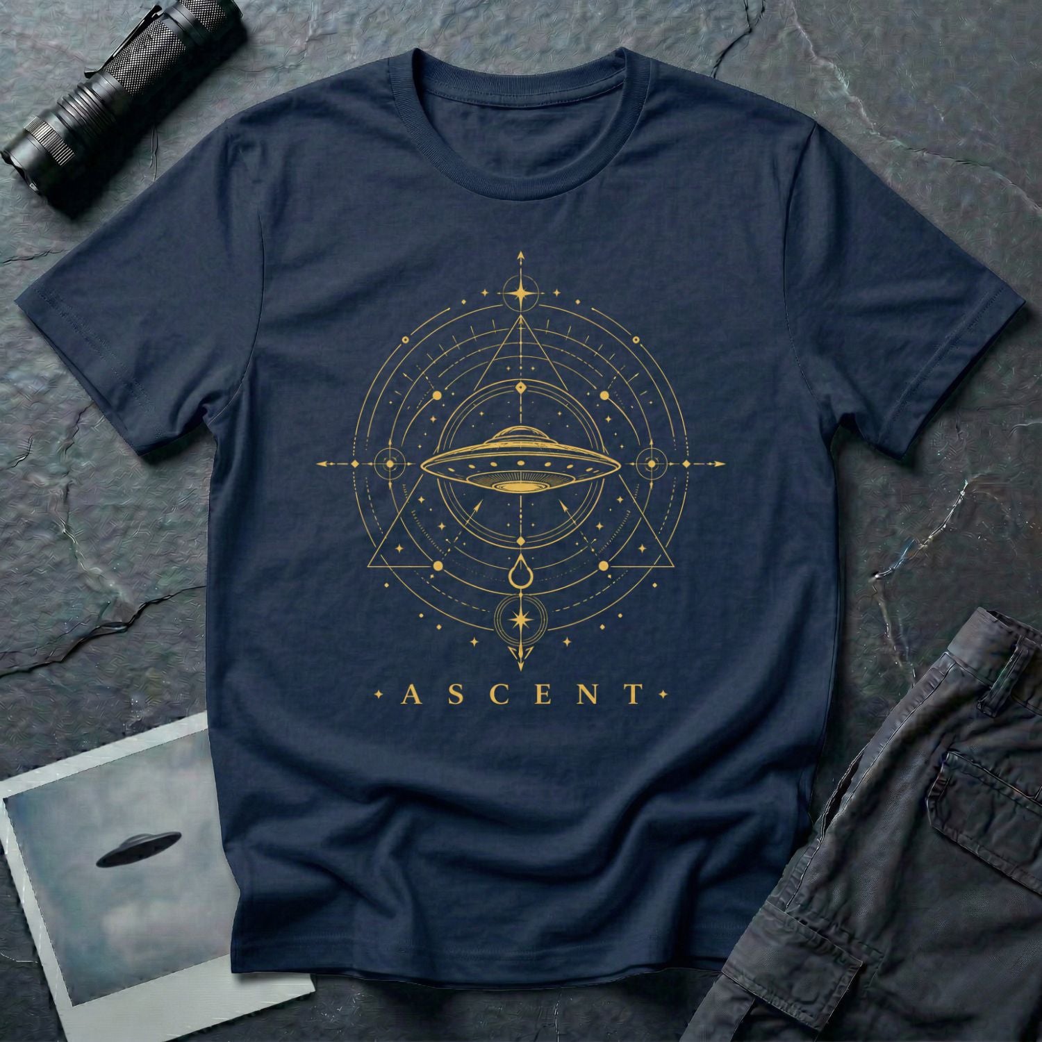 Navy blue UFO t-shirt with a flying saucer inside an upward-pointing sacred geometry triangle and compass with the word ASCENT in gold