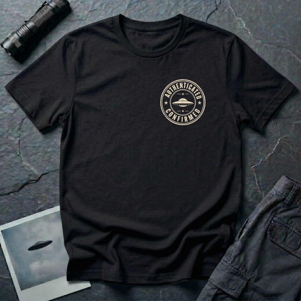 Black UFO t-shirt with a small distressed circular badge on the left chest showing a flying saucer and the words AUTHENTICATED CONFIRMED in cream white