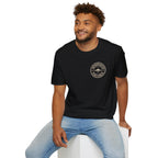 Man wearing black UFO t-shirt with a small distressed circular badge on the left chest showing a flying saucer and the words AUTHENTICATED CONFIRMED in cream white