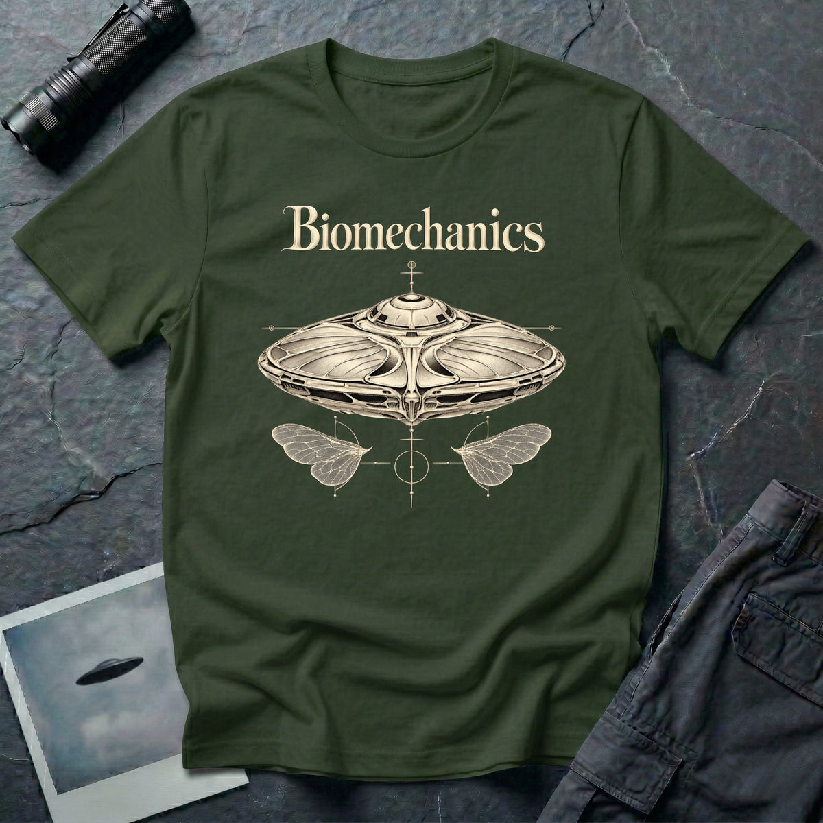 Biomechanics UFO T-shirt with an organic flying saucer, symmetrical insect wings and Victorian specimen-style ivory engraving on military green tee