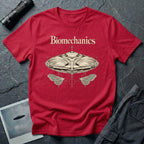 Biomechanics UFO T-shirt with an organic flying saucer, symmetrical insect wings and Victorian specimen-style ivory engraving on red tee