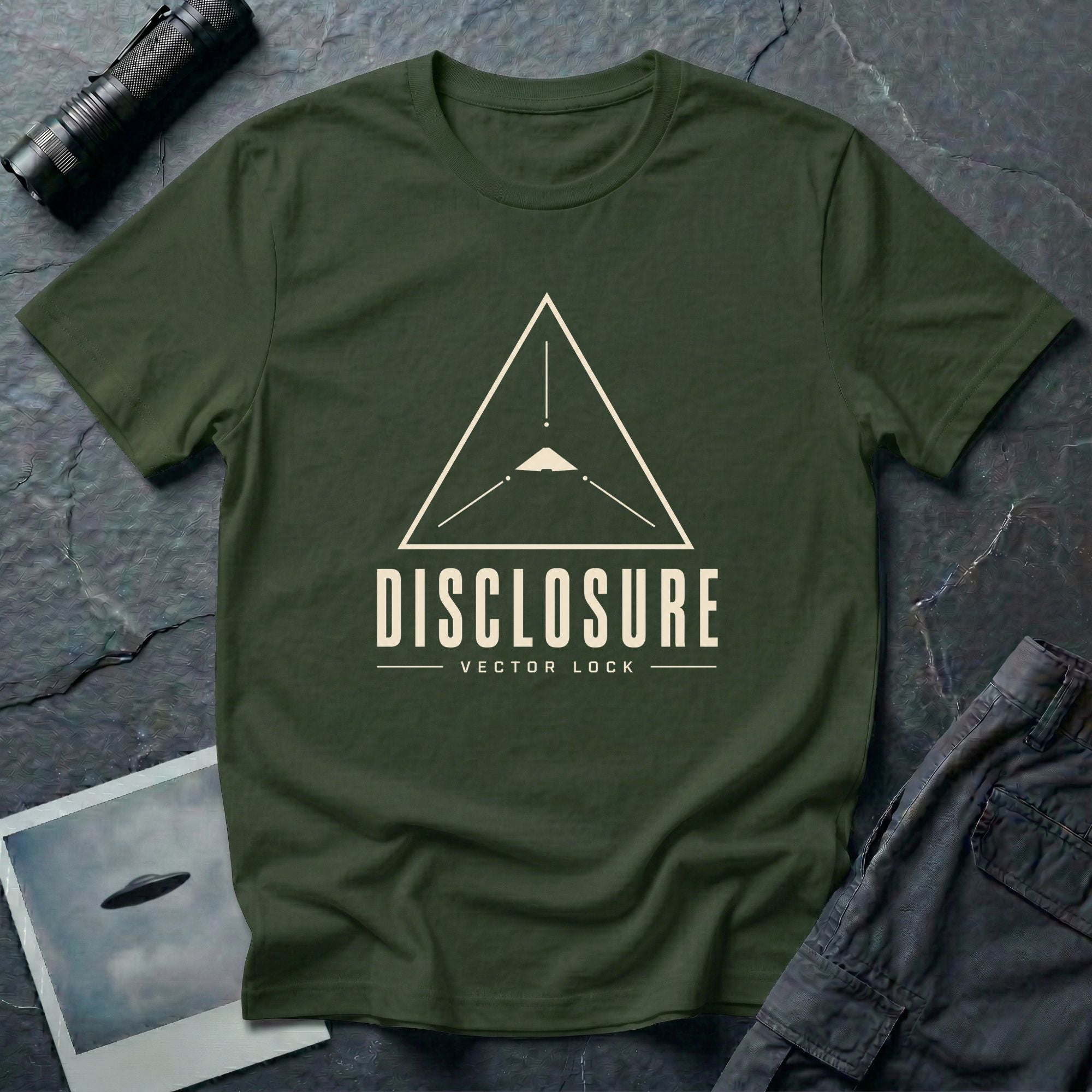 Green UFO disclosure t-shirt with a Black Triangle delta-wing craft inside an upward-pointing targeting triangle with sight lines and the words DISCLOSURE VECTOR LOCK