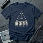 Navy blue UFO disclosure t-shirt with a Black Triangle delta-wing craft inside an upward-pointing targeting triangle with sight lines and the words DISCLOSURE VECTOR LOCK