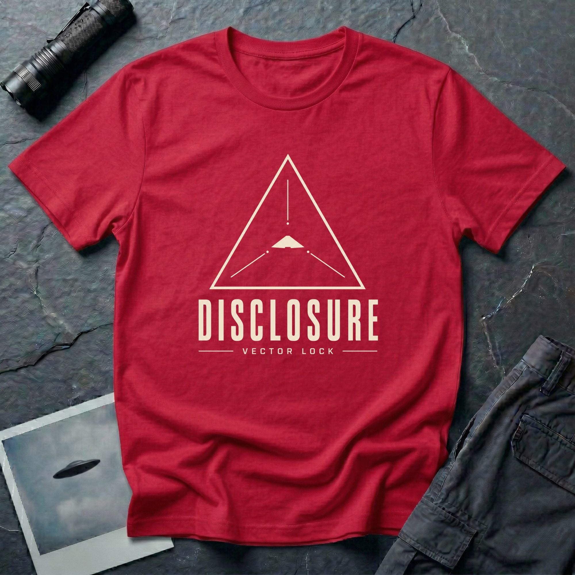 Red UFO disclosure t-shirt with a Black Triangle delta-wing craft inside an upward-pointing targeting triangle with sight lines and the words DISCLOSURE VECTOR LOCK