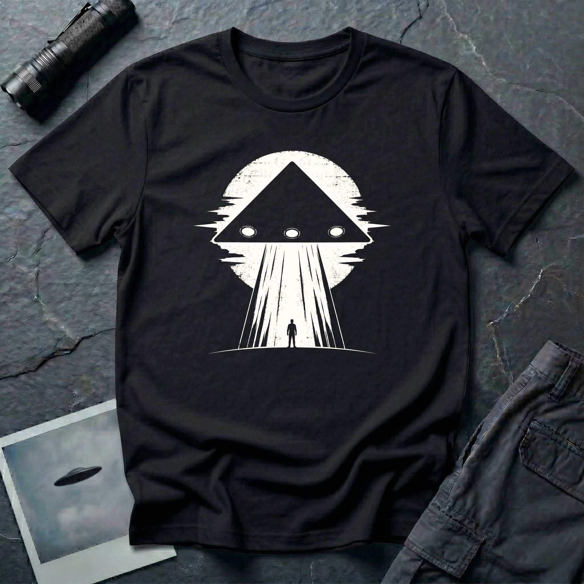 Black triangle UFO black t-shirt with lone figure silhouette and light beam against moon