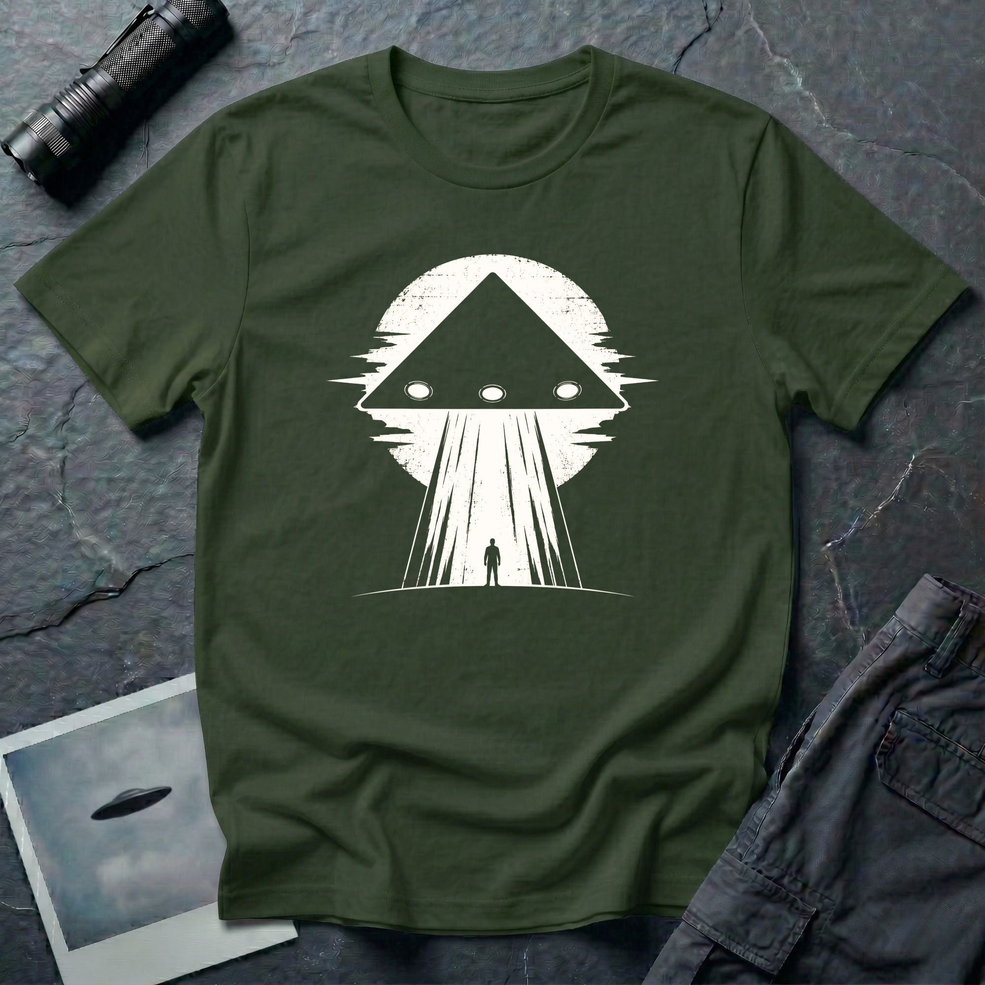 Black triangle UFO green t-shirt with lone figure silhouette and light beam against moon
