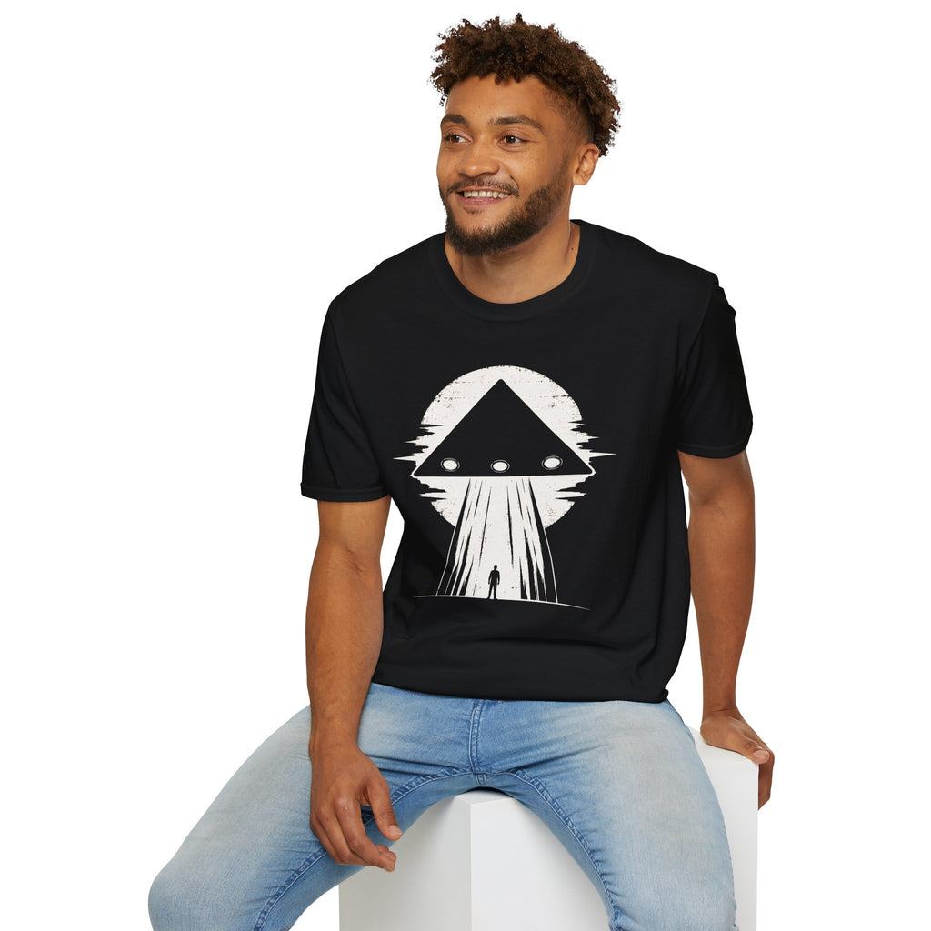 Man in black triangle black UFO t-shirt with lone figure silhouette and light beam against moon