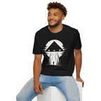 Man in black triangle black UFO t-shirt with lone figure silhouette and light beam against moon