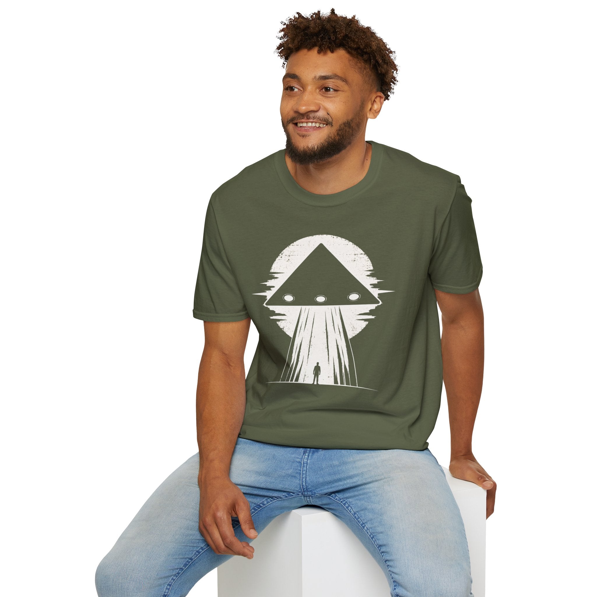 Man in black triangle UFO green t-shirt with lone figure silhouette and light beam against moon