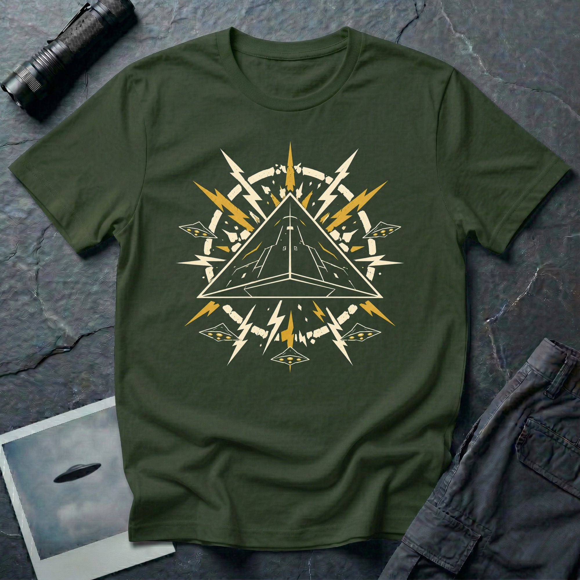 Black triangle UFO military green t-shirt with pop art emblem, lightning bolts, and surrounding craft formation