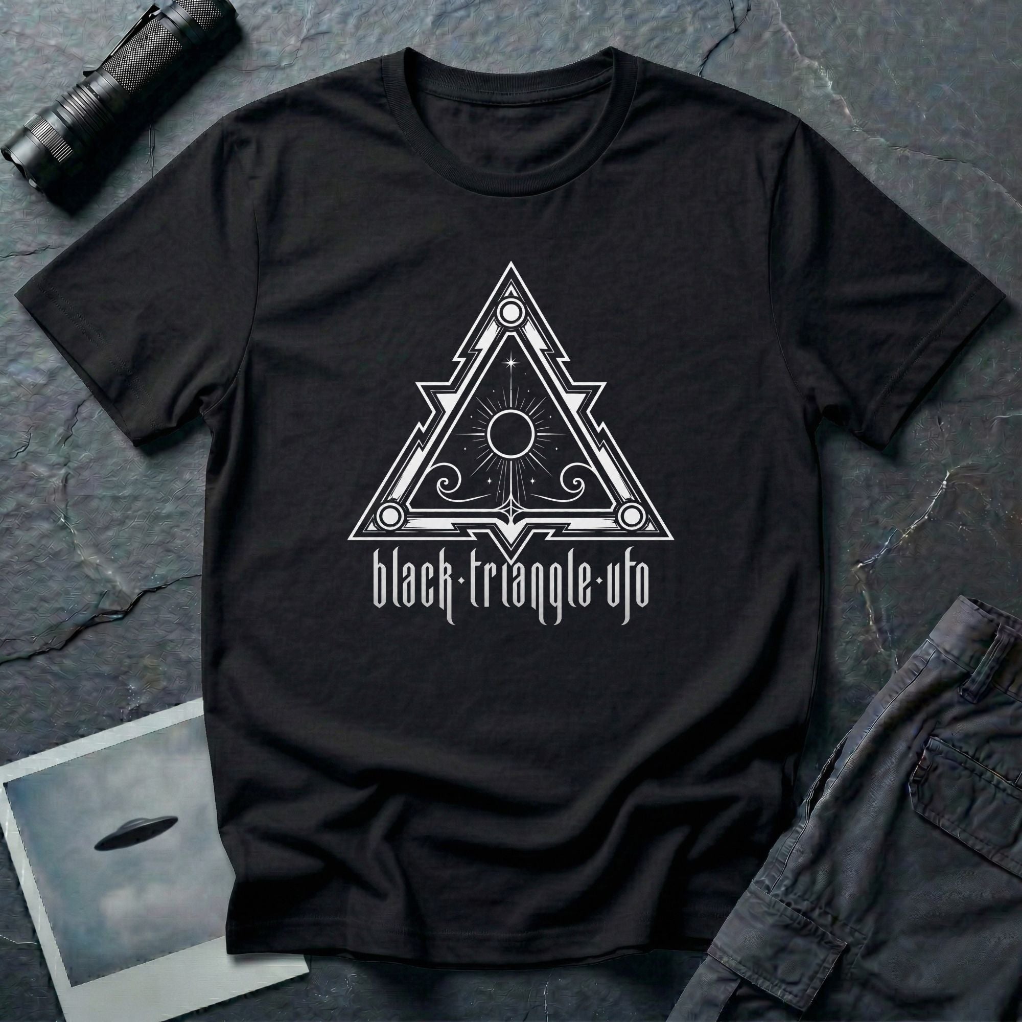 Black triangle UFO t-shirt, ornate sigil design with central sun and eye motif, gothic rock lettering below, black