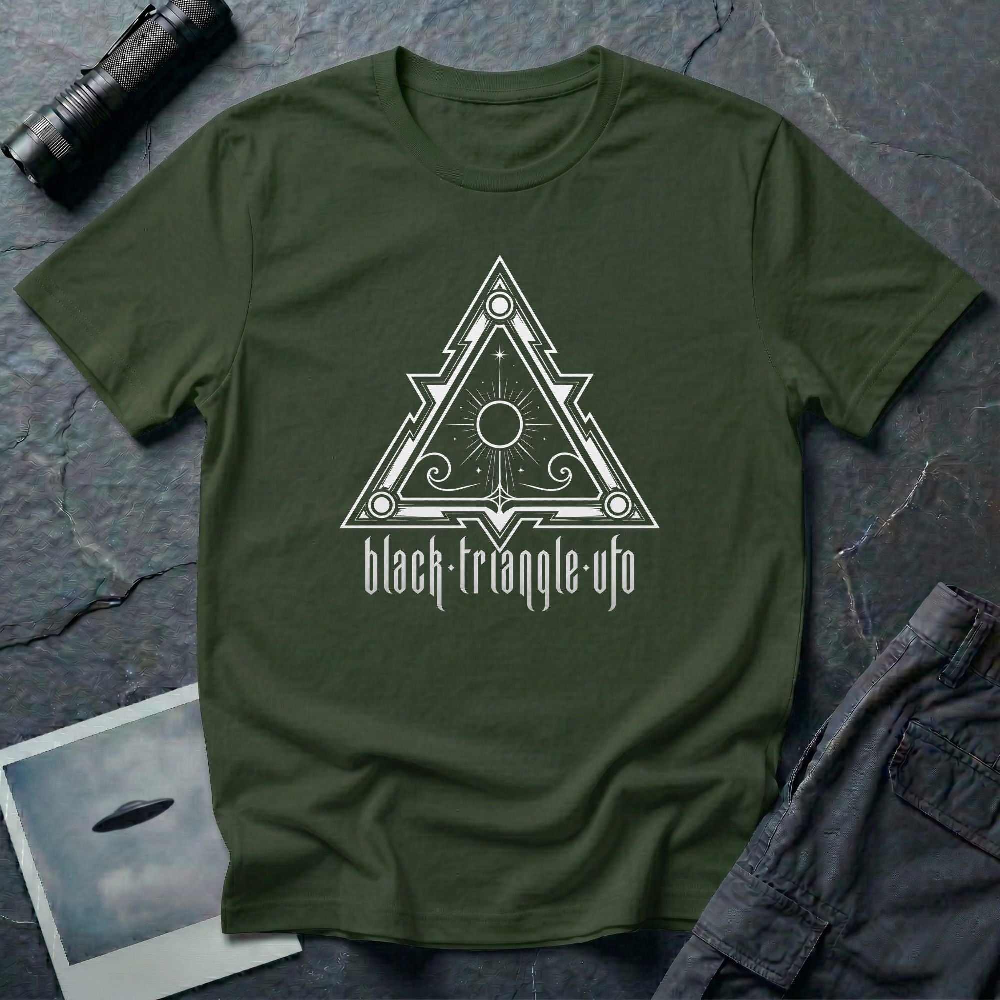 Black triangle UFO t-shirt, ornate sigil design with central sun and eye motif, gothic rock lettering below, military green
