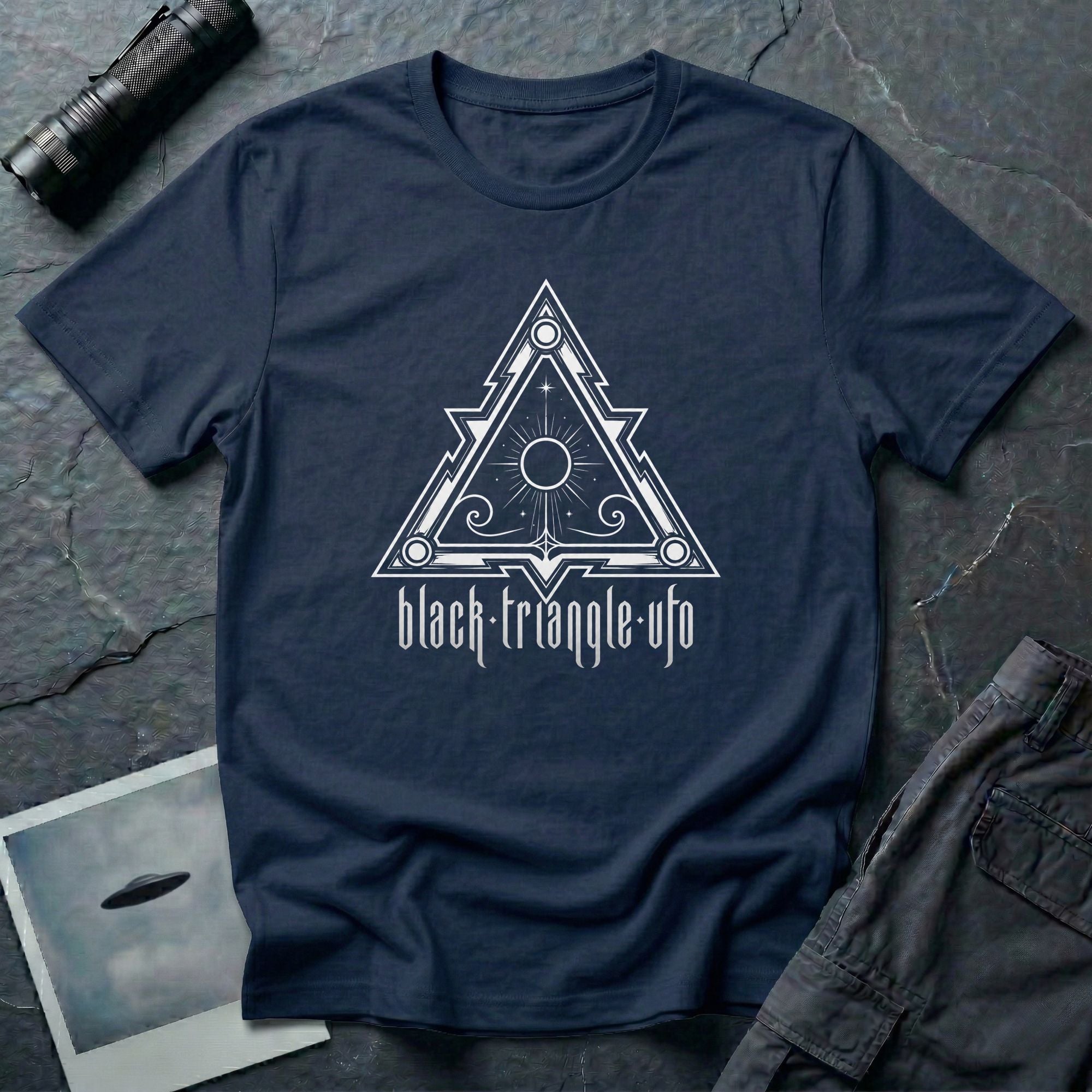 Black triangle UFO t-shirt, ornate sigil design with central sun and eye motif, gothic rock lettering below, navy blue