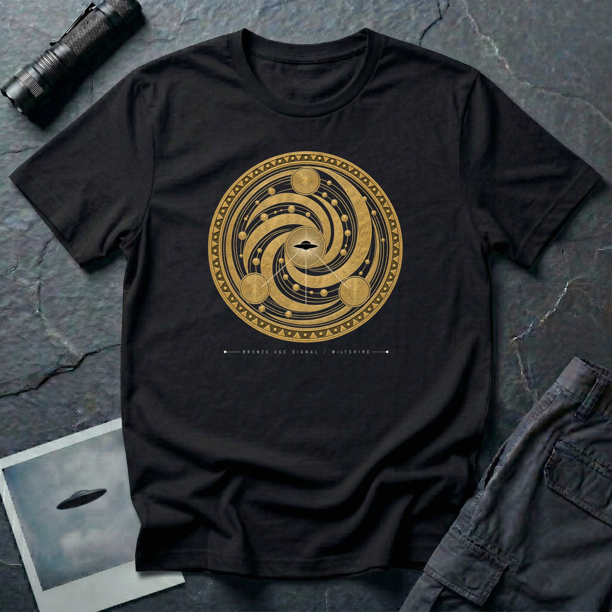 t-shirt with gold concentric sacred geometry circle and UFO at centre and Bronze Age Signal Wiltshire caption, black