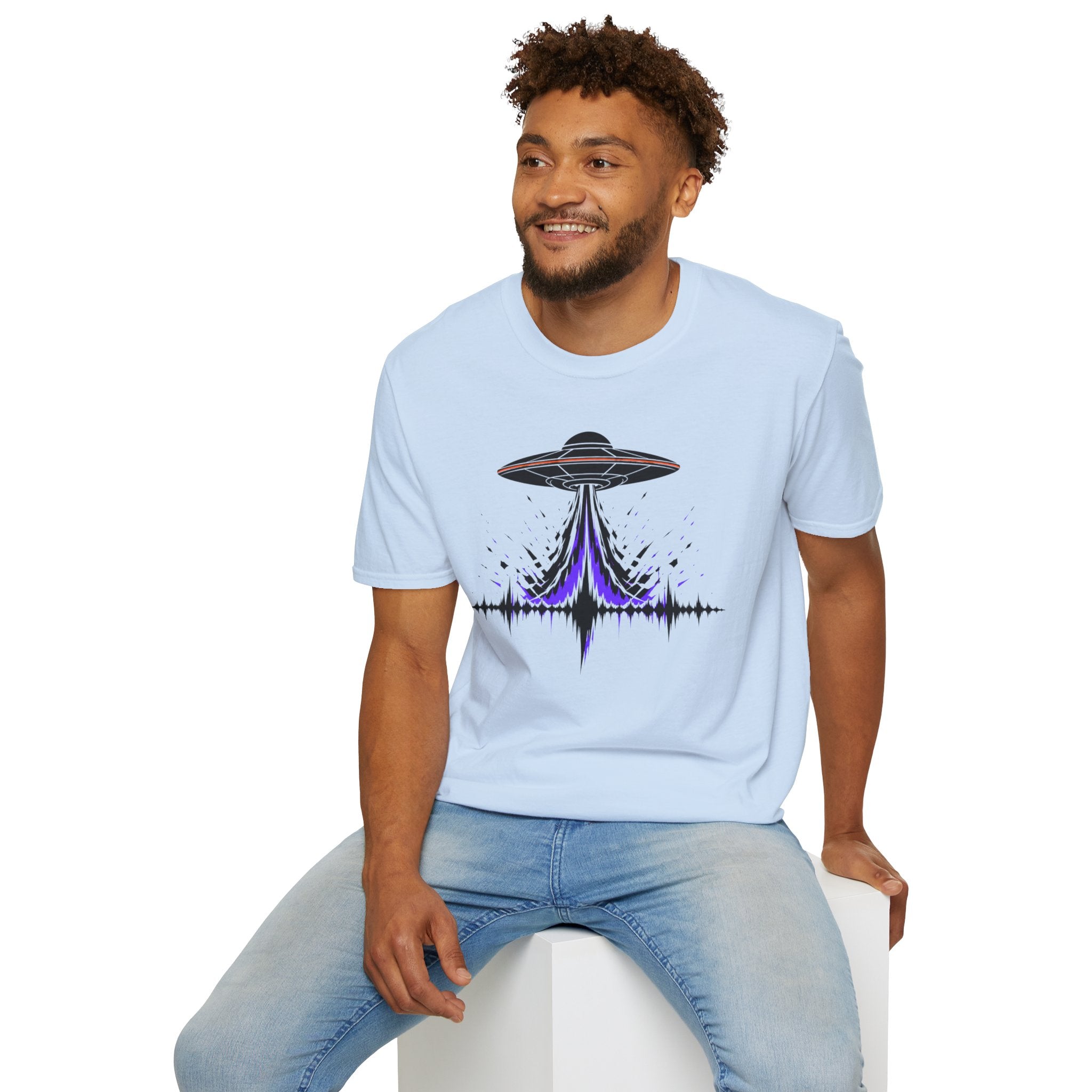 Carrier Wave UFO graphic t-shirt with black saucer emitting a purple and black audio frequency waveform, light blue, worn by a model