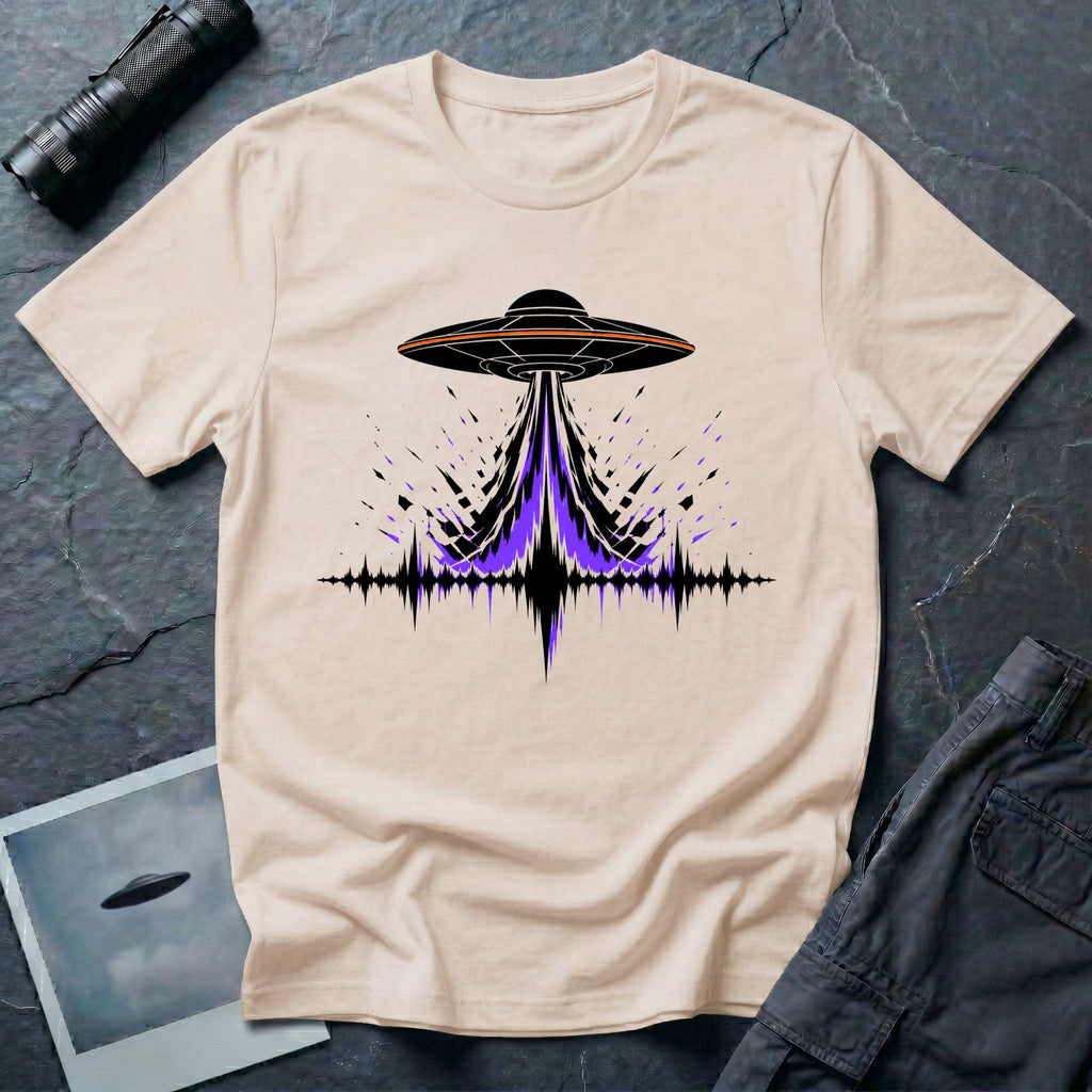 Carrier Wave UFO graphic t-shirt with black saucer emitting a purple and black audio frequency waveform, natural