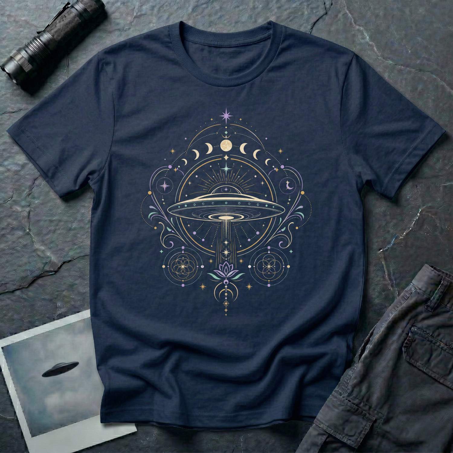 Navy Blue t-shirt with a celestial mandala UFO design featuring lunar phase sequence lotus flower seed of life geometry and central saucer in gold lavender and teal linework