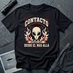 Black t-shirt with vintage rock poster style alien head, UFO, and Spanish text reading Contacto Estamos Aquí Desde El Más Allá