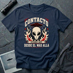 Navy blue t-shirt with vintage rock poster style alien head, UFO, and Spanish text reading Contacto Estamos Aquí Desde El Más Allá