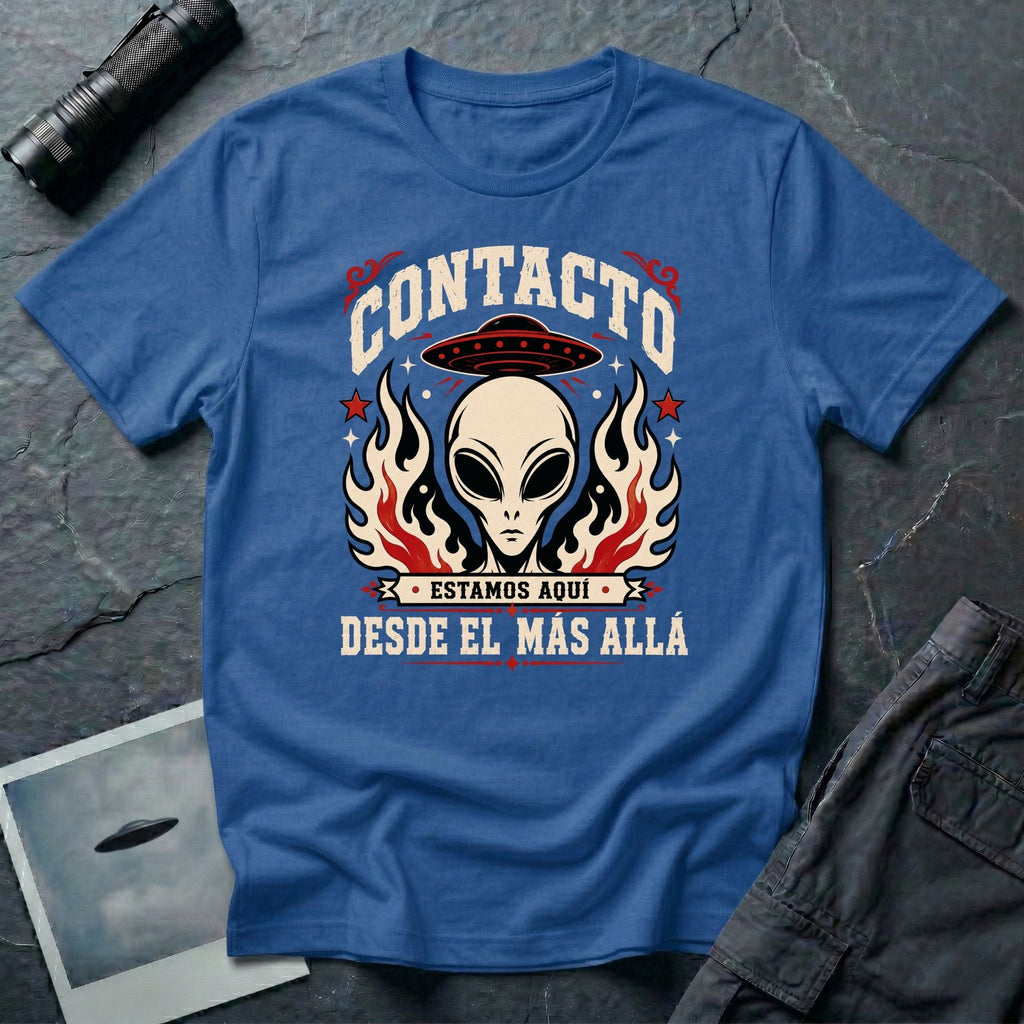 Royal blue t-shirt with vintage rock poster style alien head, UFO, and Spanish text reading Contacto Estamos Aquí Desde El Más Allá
