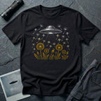 Dandelion UFO Fleet t-shirt with gold botanical dandelions releasing seed saucers toward a white mothership, black tee