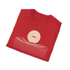 Desert Crossing UFO T-shirt with a black flying saucer crossing a white moon above minimalist line-art desert dunes, red tee
