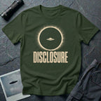 Green UFO disclosure t-shirt with a flying saucer silhouetted inside a total solar eclipse with radiant corona and the word DISCLOSURE in distressed block letters