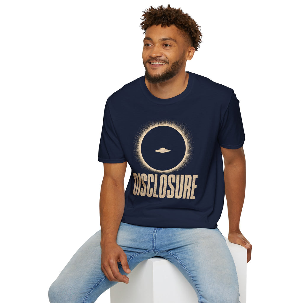 Man wearing navy blue UFO disclosure t-shirt with a flying saucer silhouetted inside a total solar eclipse with radiant corona and the word DISCLOSURE in distressed block letters