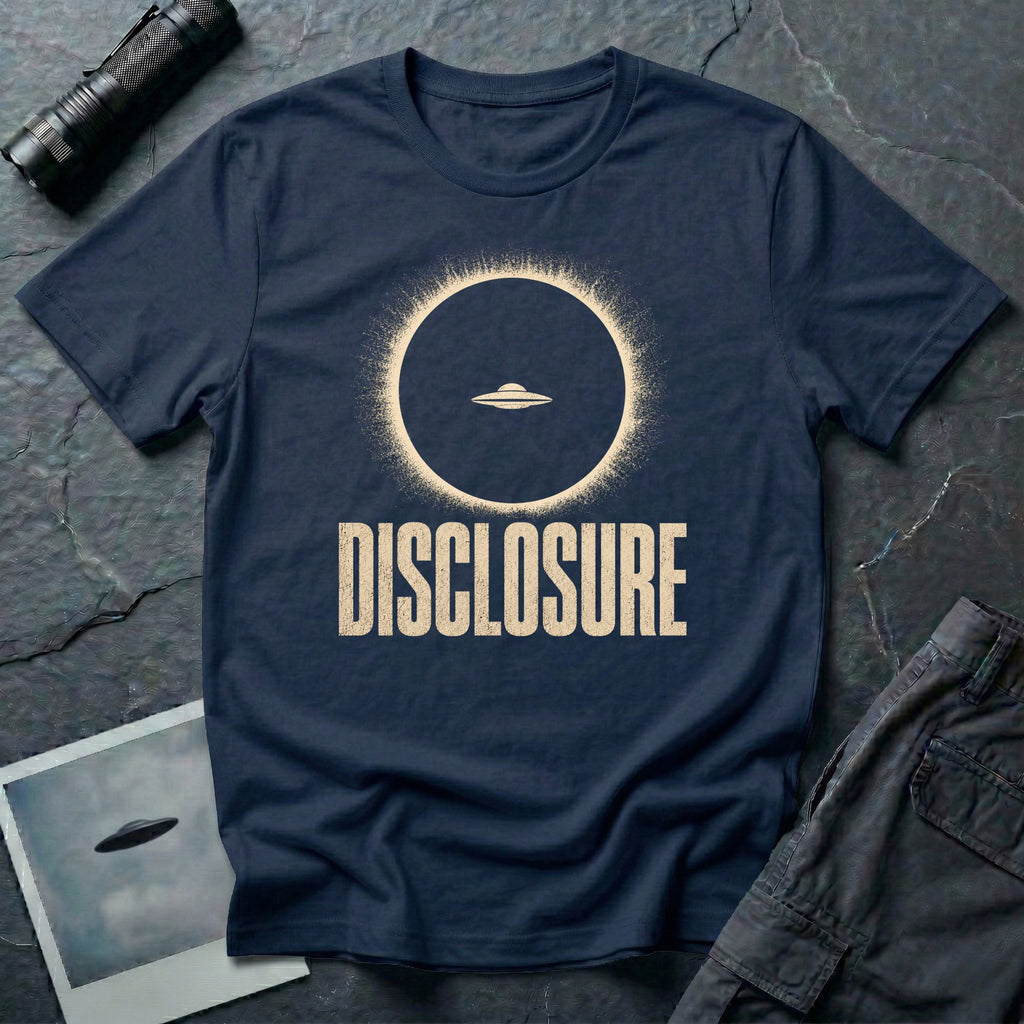 Navy blue UFO disclosure t-shirt with a flying saucer silhouetted inside a total solar eclipse with radiant corona and the word DISCLOSURE in distressed block letters