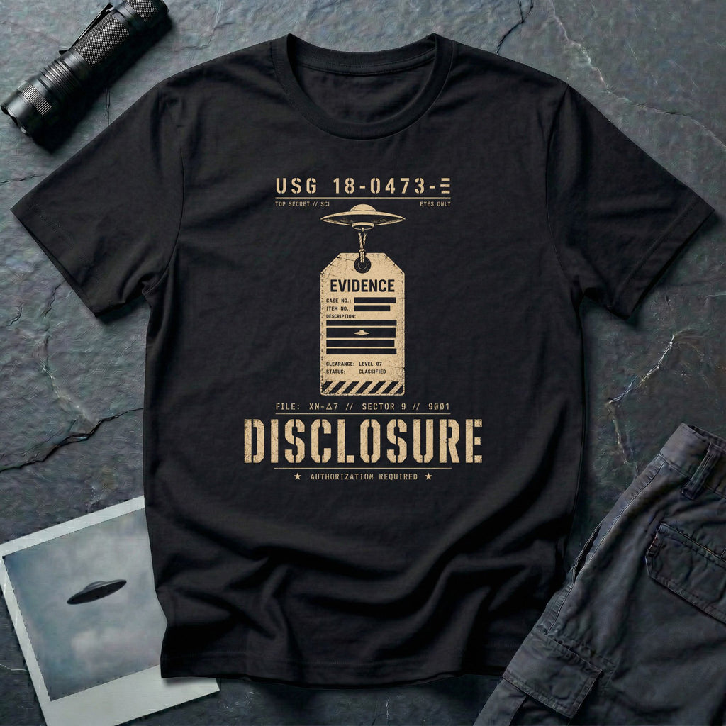 Black UFO disclosure t-shirt with a classified evidence tag hanging from a flying saucer showing TOP SECRET SCI EYES ONLY and the word DISCLOSURE in distressed stencil type