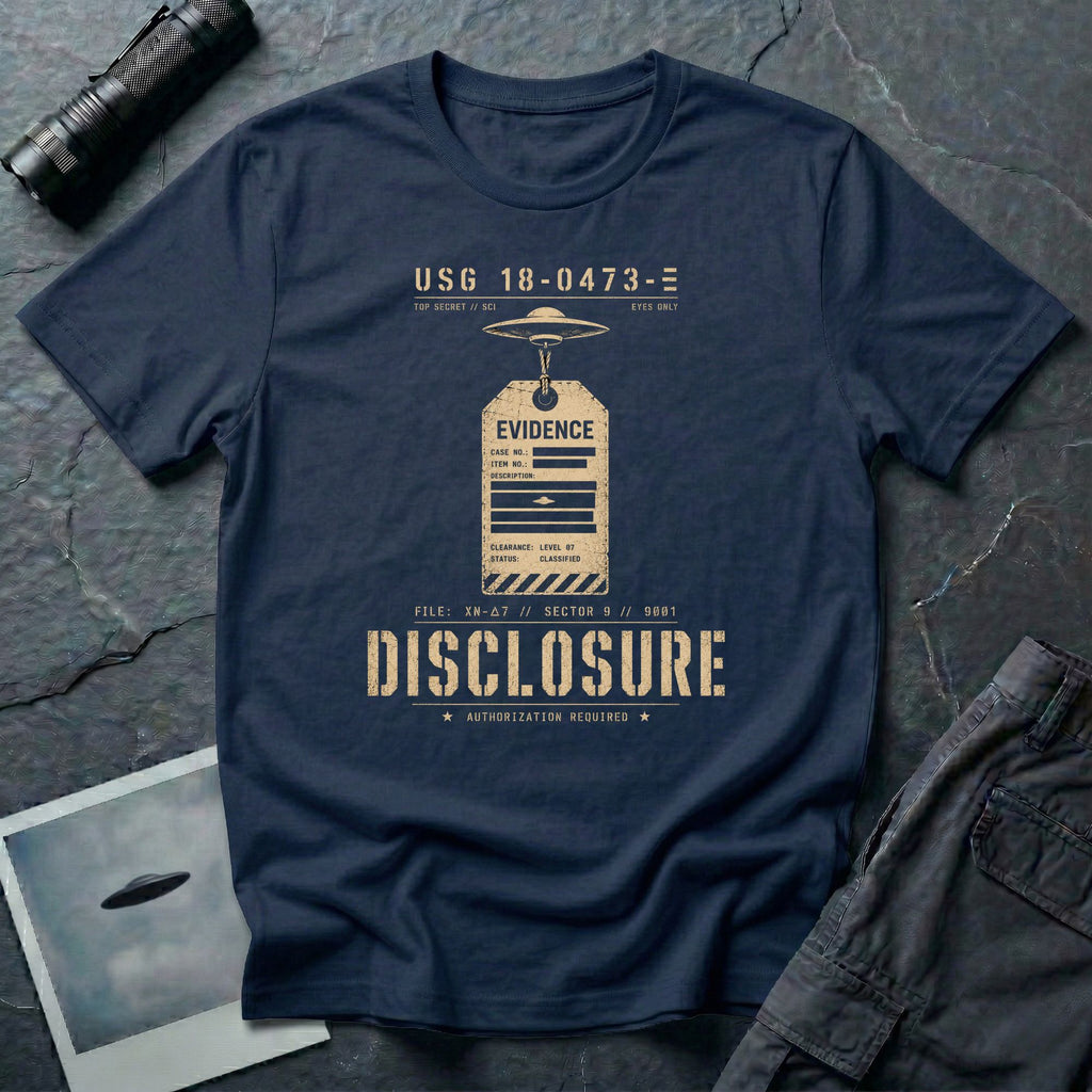 Navy blue UFO disclosure t-shirt with a classified evidence tag hanging from a flying saucer showing TOP SECRET SCI EYES ONLY and the word DISCLOSURE in distressed stencil type