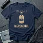 Navy blue UFO disclosure t-shirt with a classified evidence tag hanging from a flying saucer showing TOP SECRET SCI EYES ONLY and the word DISCLOSURE in distressed stencil type