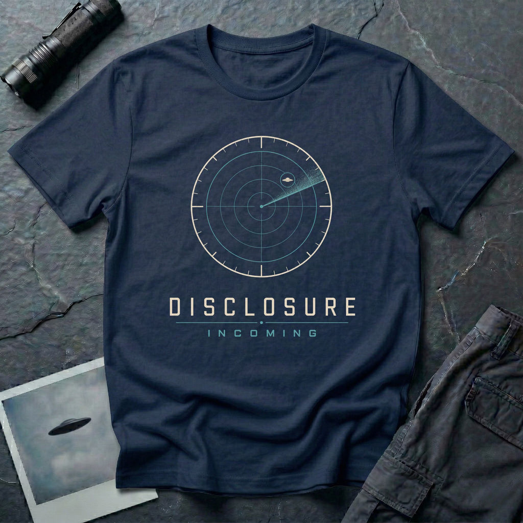 Navy blue UFO disclosure t-shirt with a classic radar screen showing a flying saucer tracked in the upper quadrant with a sweep trail and the words DISCLOSURE INCOMING in cream and cyan