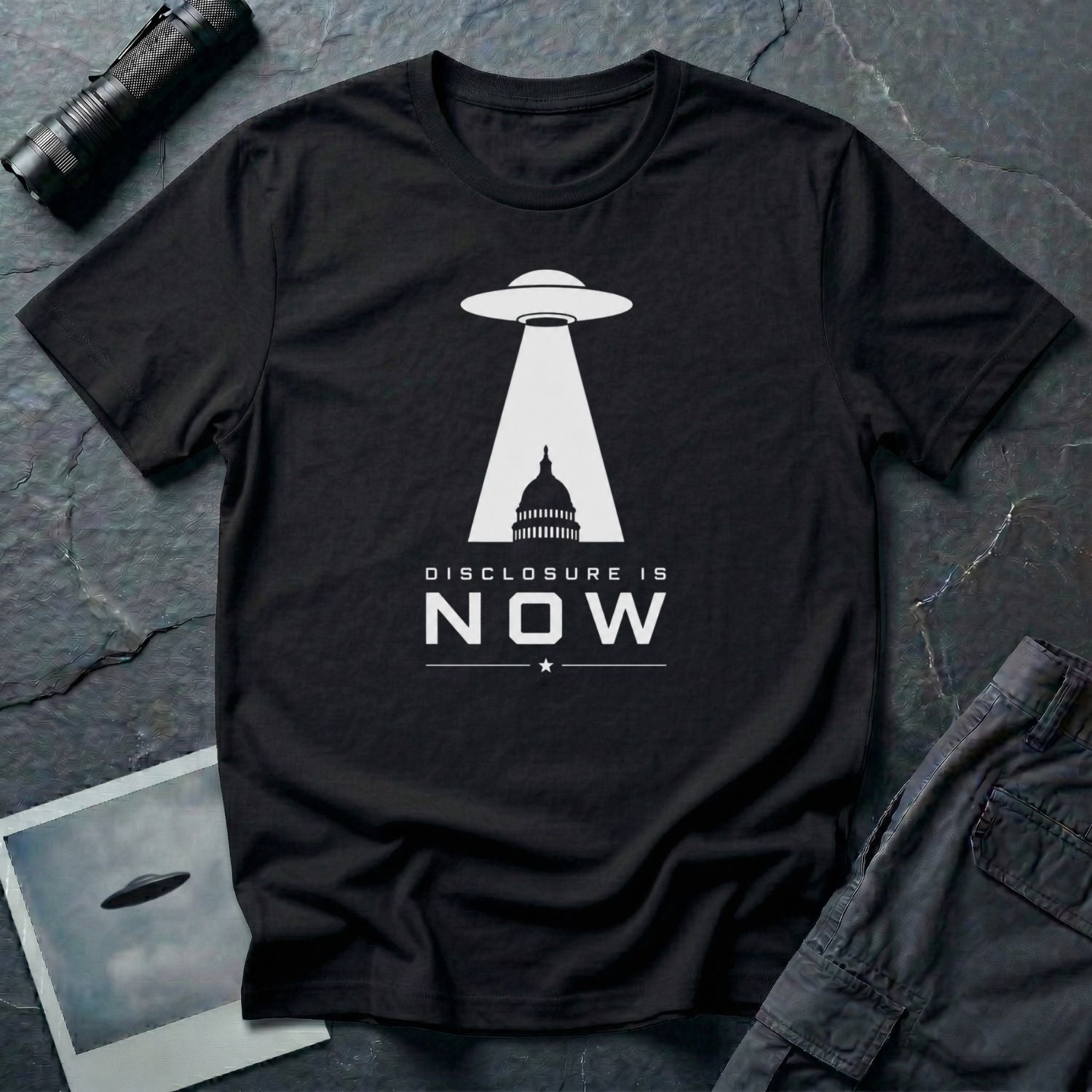 Black UFO disclosure t-shirt with a flying saucer beaming the US Capitol building in white with the words DISCLOSURE IS NOW
