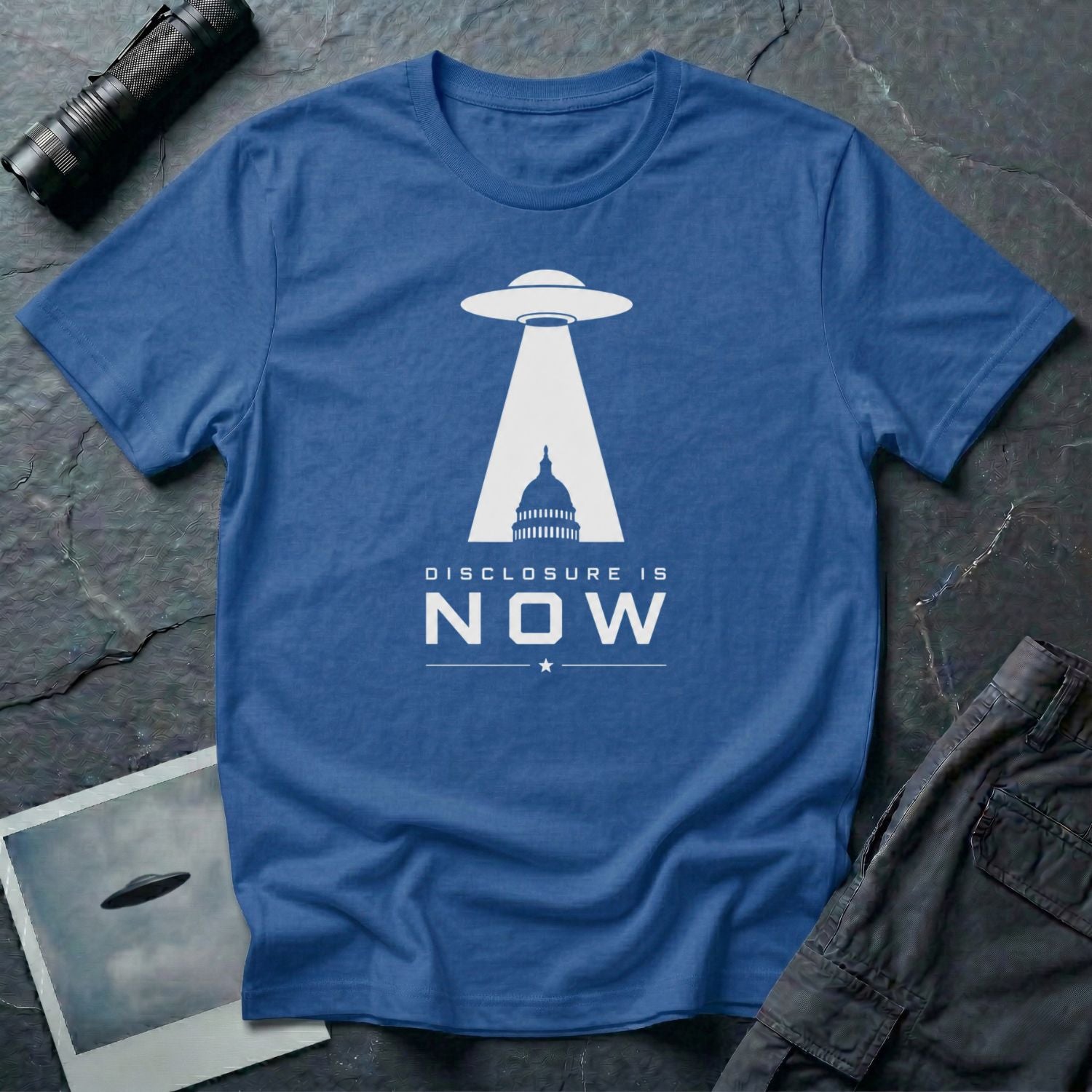 Royal blue UFO disclosure t-shirt with a flying saucer beaming the US Capitol building in white with the words DISCLOSURE IS NOW
