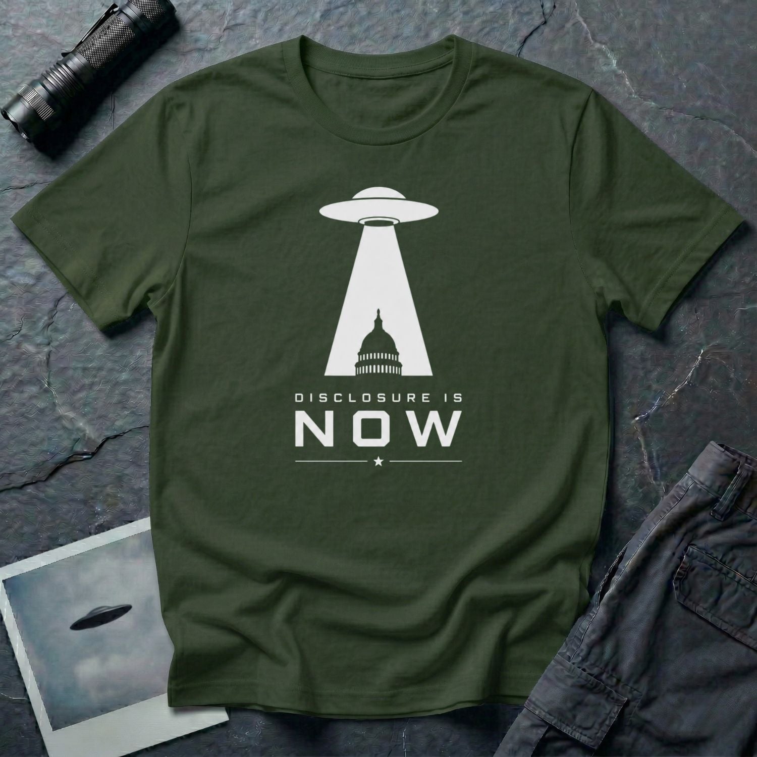 Military green UFO disclosure t-shirt with a flying saucer beaming the US Capitol building in white with the words DISCLOSURE IS NOW
