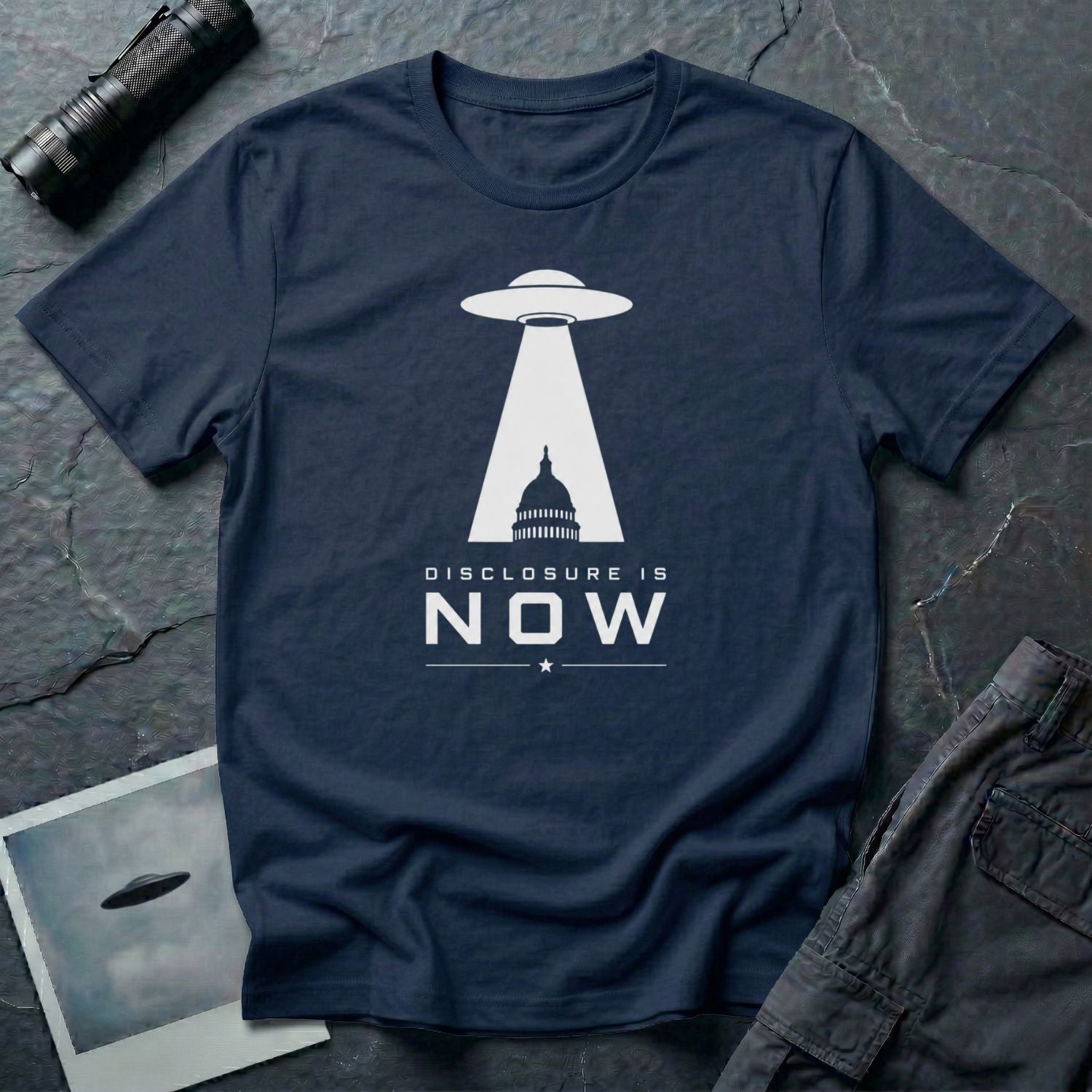 Navy blue UFO disclosure t-shirt with a flying saucer beaming the US Capitol building in white with the words DISCLOSURE IS NOW
