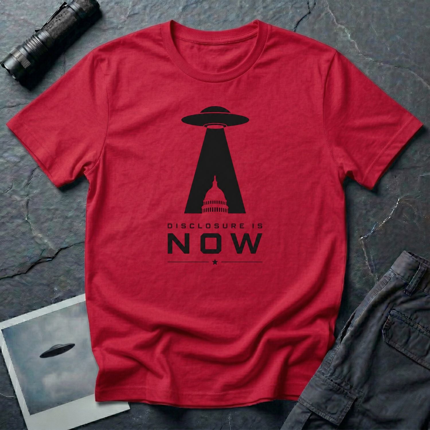 Red UFO disclosure t-shirt with a flying saucer beaming the US Capitol building in black with the words DISCLOSURE IS NOW
