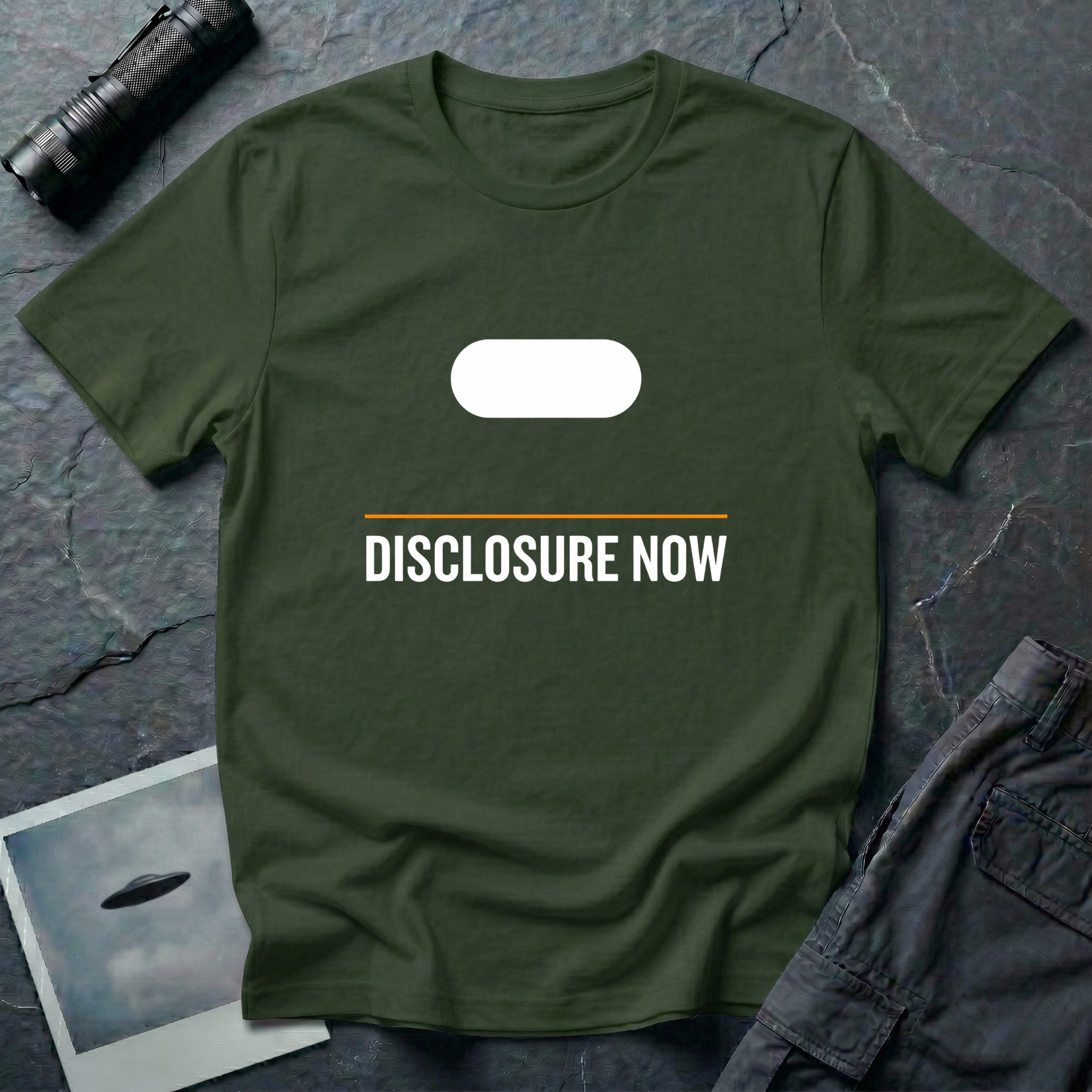 Green t-shirt with white Tic Tac UFO silhouette above an orange horizontal rule and DISCLOSURE NOW in bold white caps
