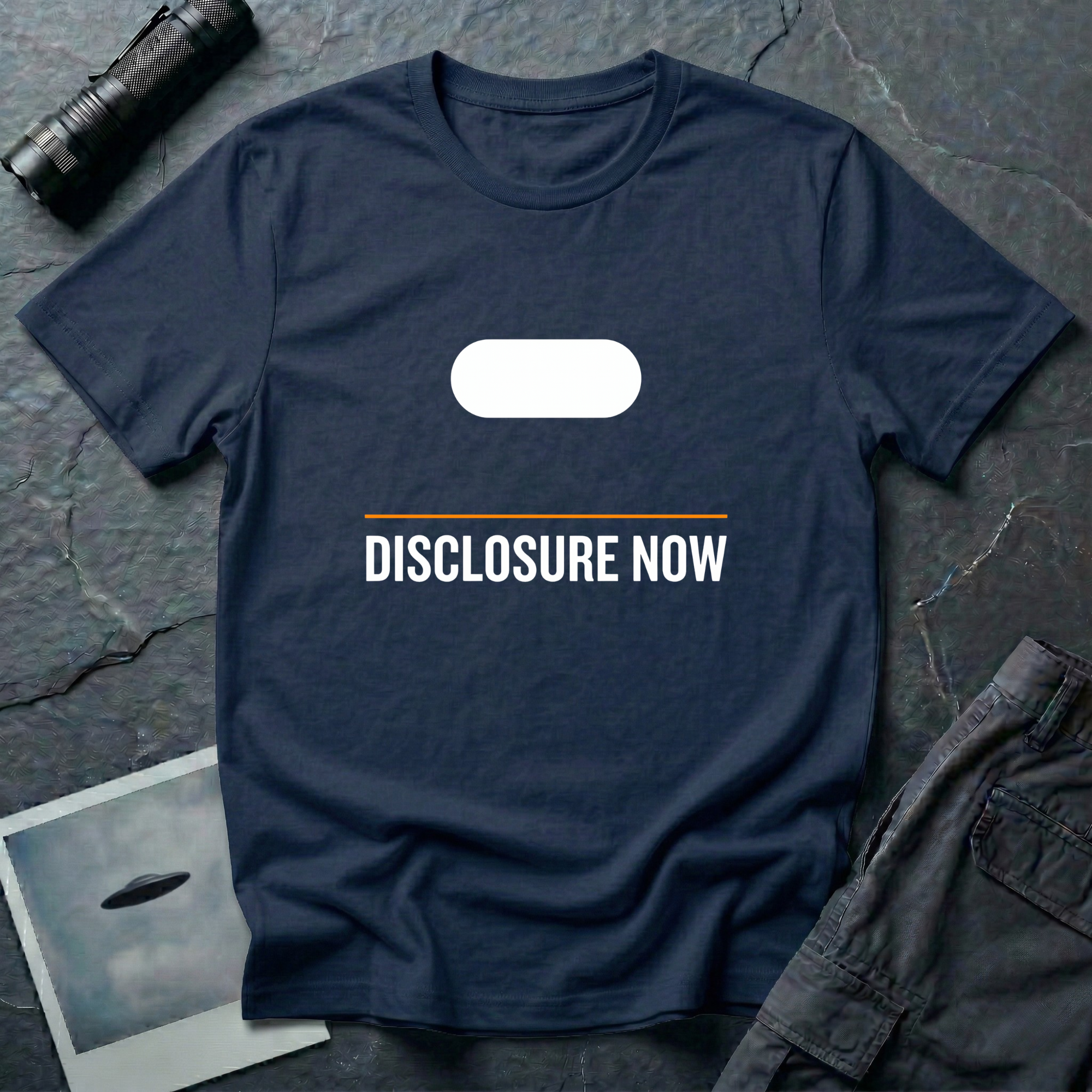Navy Blue t-shirt with white Tic Tac UAP silhouette above an orange horizontal rule and DISCLOSURE NOW in bold white caps