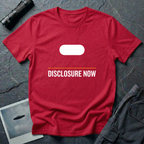 Black t-shirt with white Tic Tac UFO silhouette above an orange horizontal rule and DISCLOSURE NOW in bold white caps