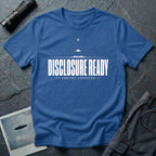 Blue UFO disclosure t-shirt with bold block letters reading DISCLOSURE READY and subtitle CONTACT EXPECTED with a small flying saucer above the horizon in white