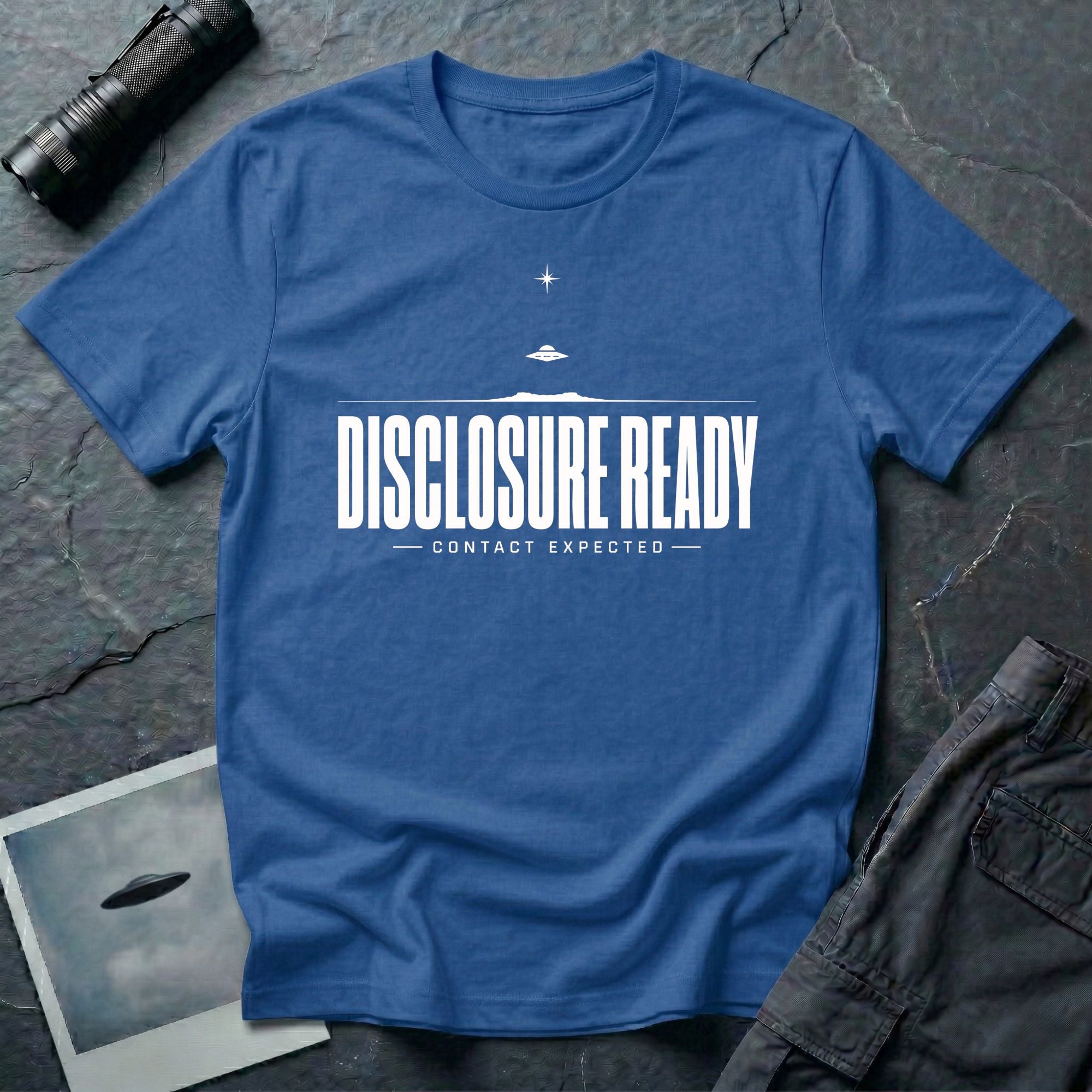 Blue UFO disclosure t-shirt with bold block letters reading DISCLOSURE READY and subtitle CONTACT EXPECTED with a small flying saucer above the horizon in white