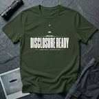 Green UFO disclosure t-shirt with bold block letters reading DISCLOSURE READY and subtitle CONTACT EXPECTED with a small flying saucer above the horizon in white