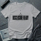Grey UFO disclosure t-shirt with bold block letters reading DISCLOSURE READY and subtitle CONTACT EXPECTED with a small flying saucer above the horizon in black
