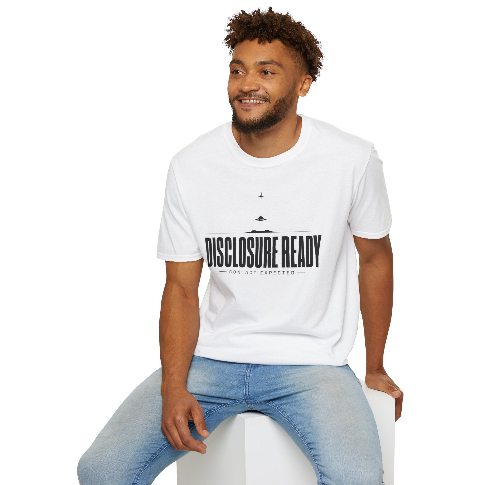 Man wearing white UFO disclosure t-shirt with bold block letters reading DISCLOSURE READY and subtitle CONTACT EXPECTED with a small flying saucer above the horizon in black