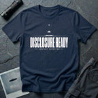 Navy blue UFO disclosure t-shirt with bold block letters reading DISCLOSURE READY and subtitle CONTACT EXPECTED with a small flying saucer above the horizon in white