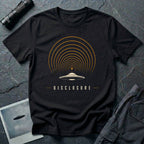 Black UFO disclosure t-shirt with a flying saucer broadcasting concentric signal arcs upward in orange and cream with the word DISCLOSURE beneath