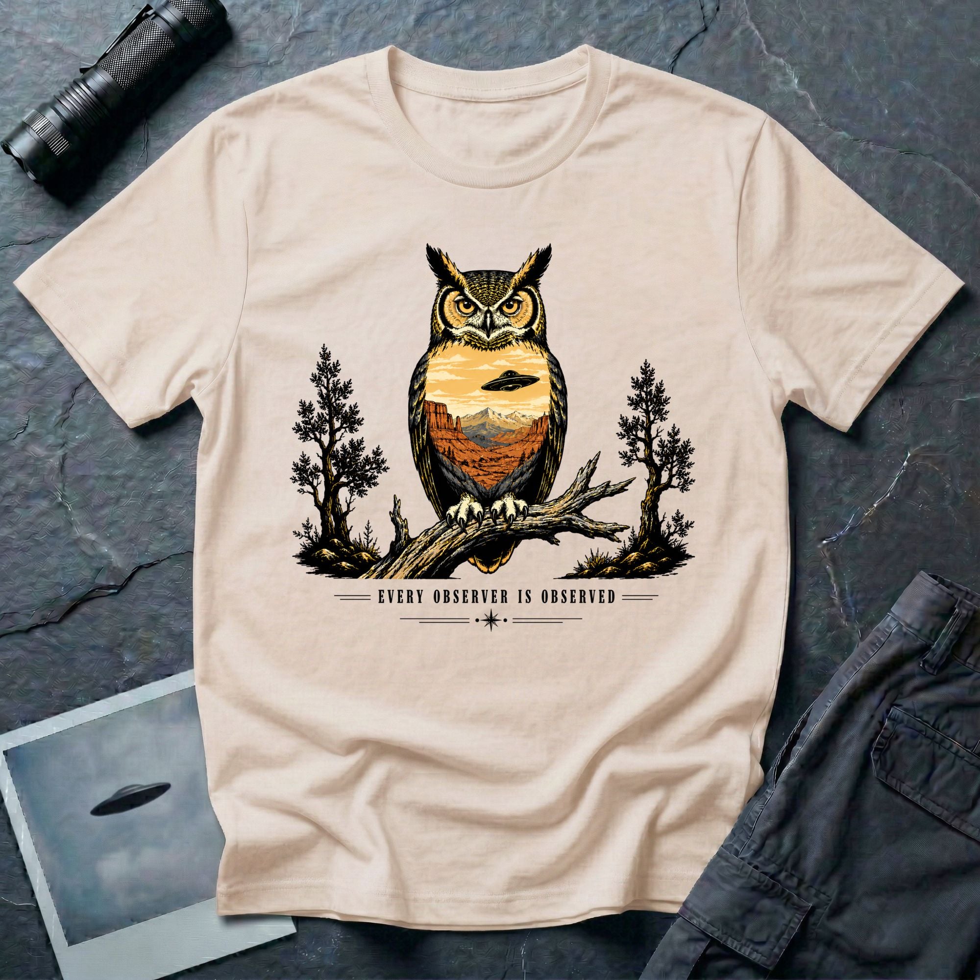 Every Observer Is Observed UFO t-shirt with owl double exposure and single tilted saucer in desert skyline, natural
